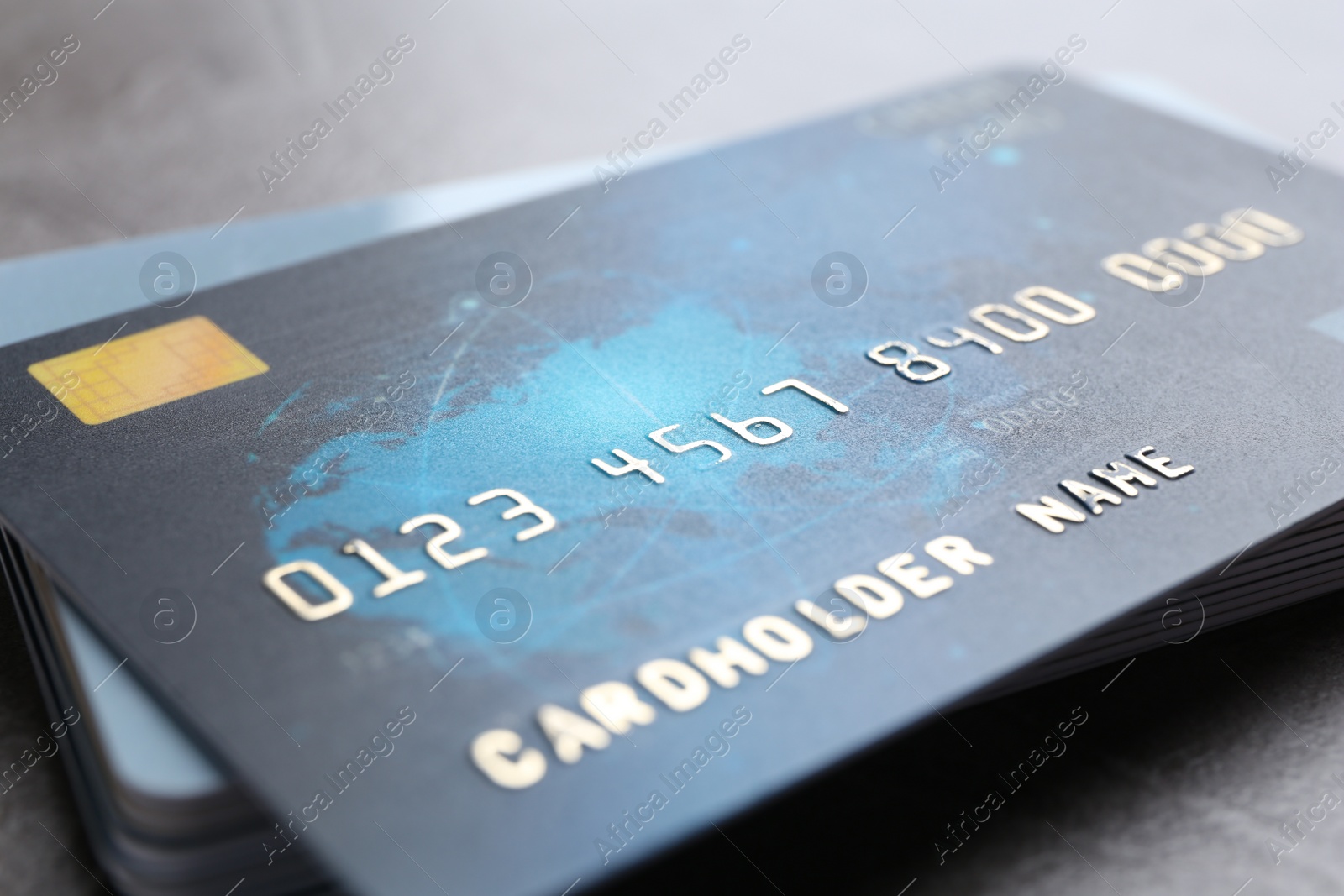 Photo of Many credit cards on grey table, closeup