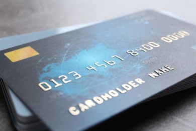 Photo of Many credit cards on grey table, closeup