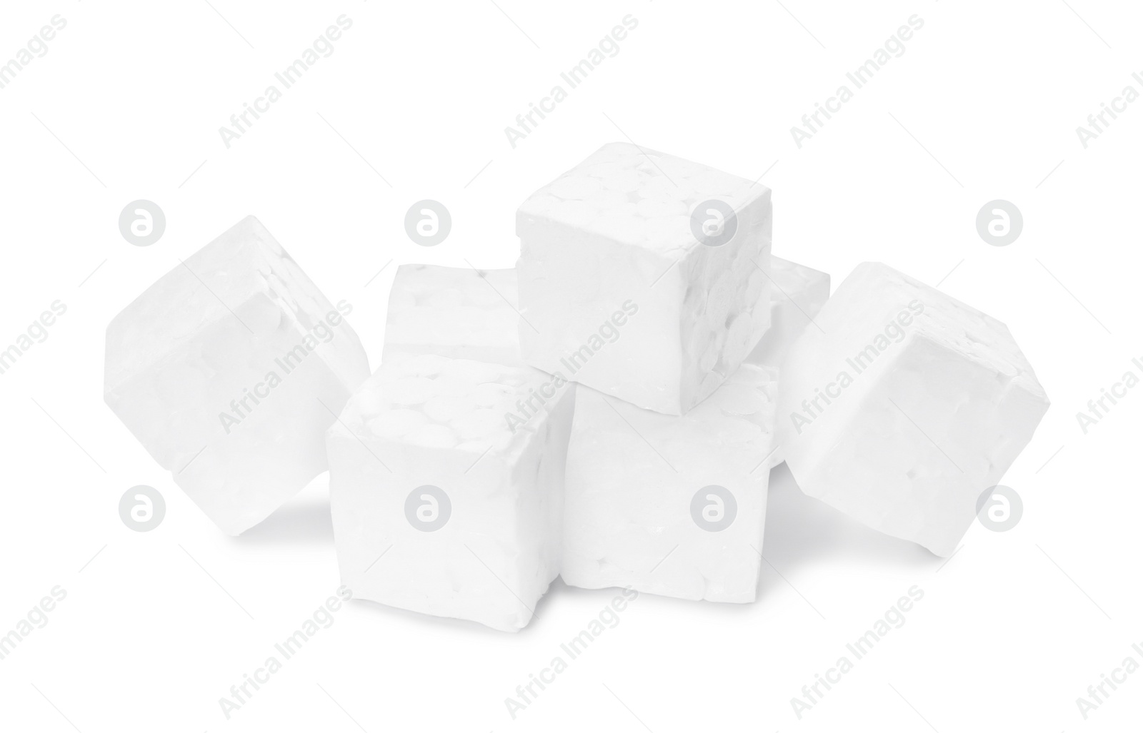 Photo of Many small styrofoam cubes on white background