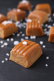 Photo of Salted caramel on grey table, closeup view