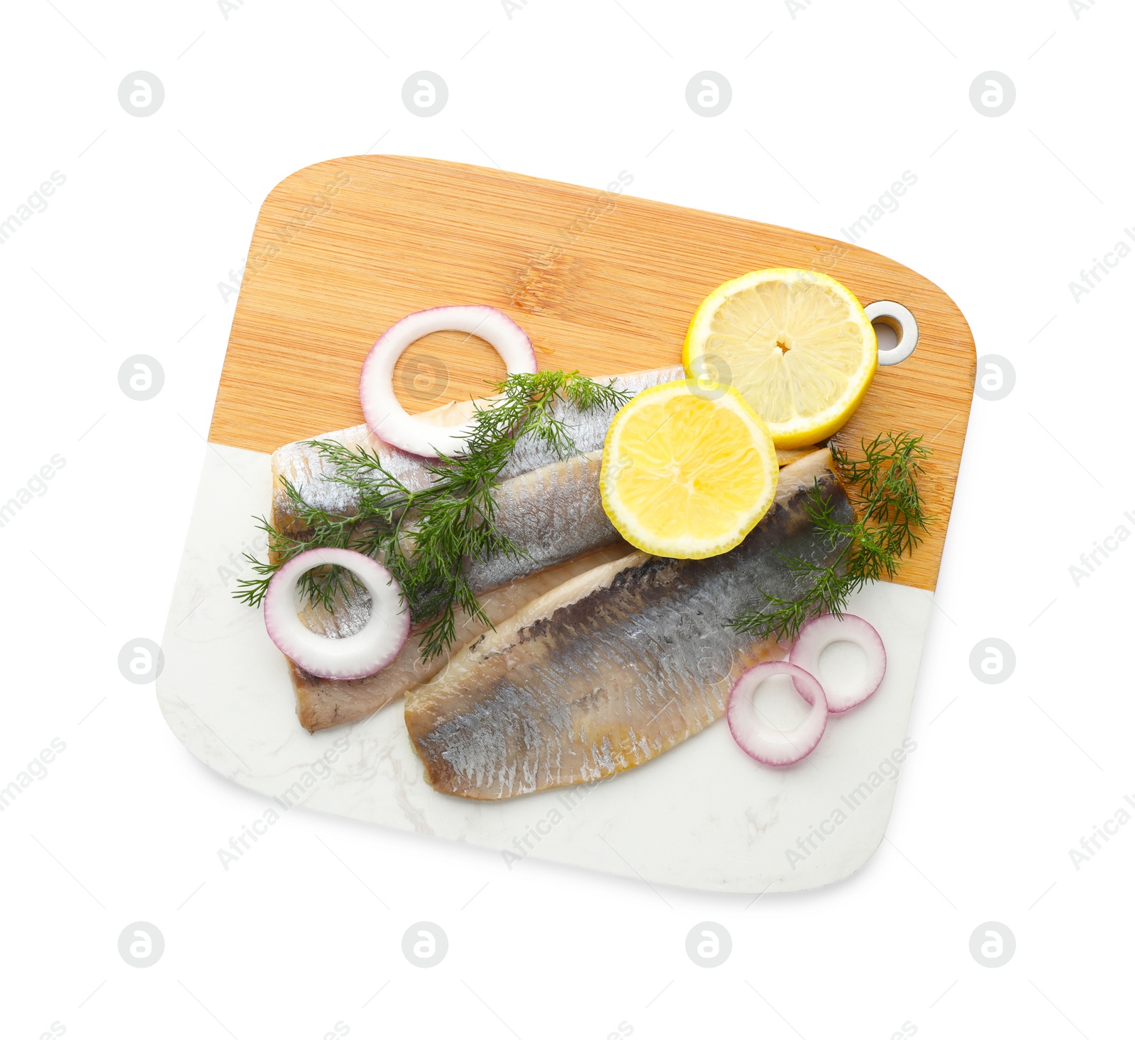 Photo of Board with delicious salted herring fillets, onion rings, dill and lemon isolated on white, top view