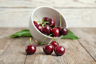 Sweet red cherries on wooden table