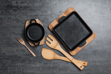 Set of cooking utensils on grey table, flat lay