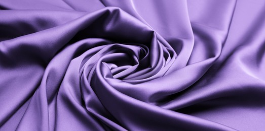 Delicate violet silk fabric as background, closeup view