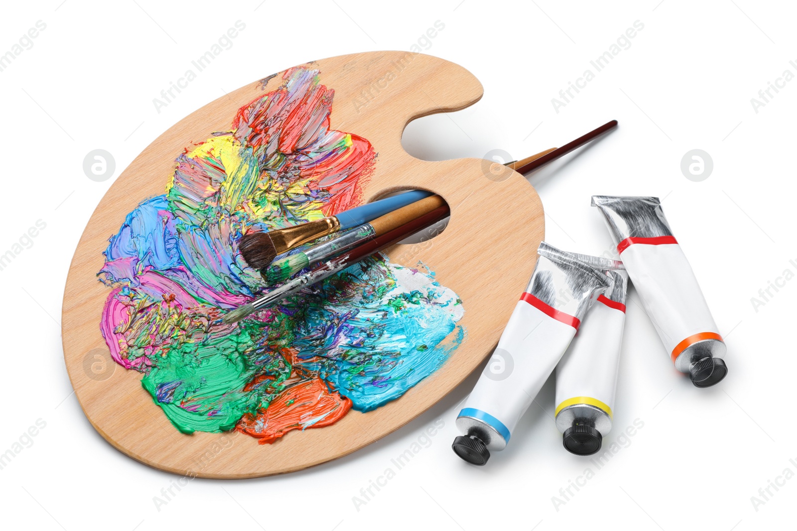 Photo of Palette with acrylic paints and brushes on white background. Artist equipment