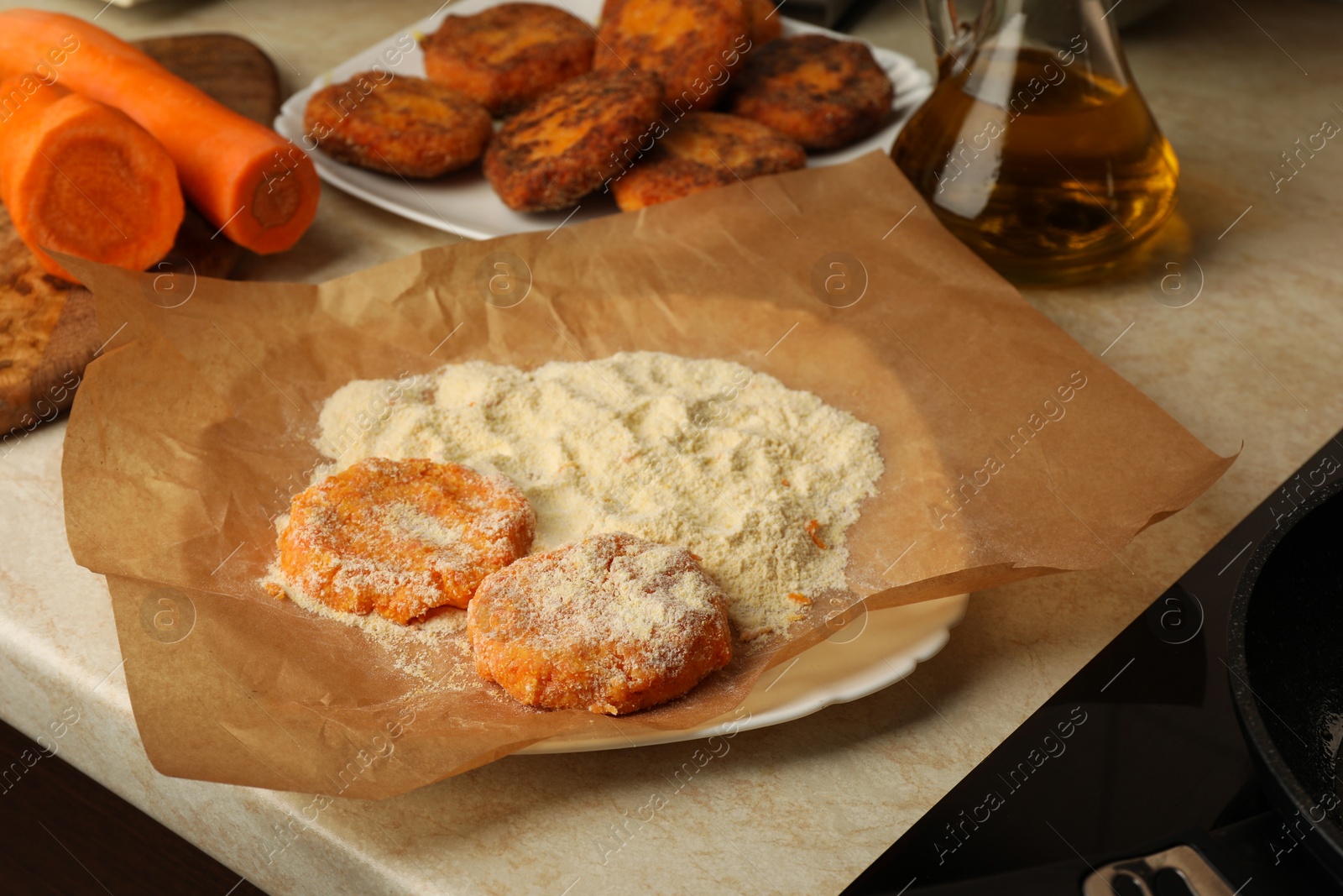 Photo of Raw vegan cutlets with flour on plate