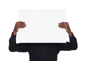 African American man holding sheet of paper on white background. Mockup for design