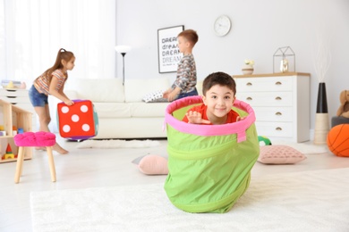 Cute little children playing together, indoors