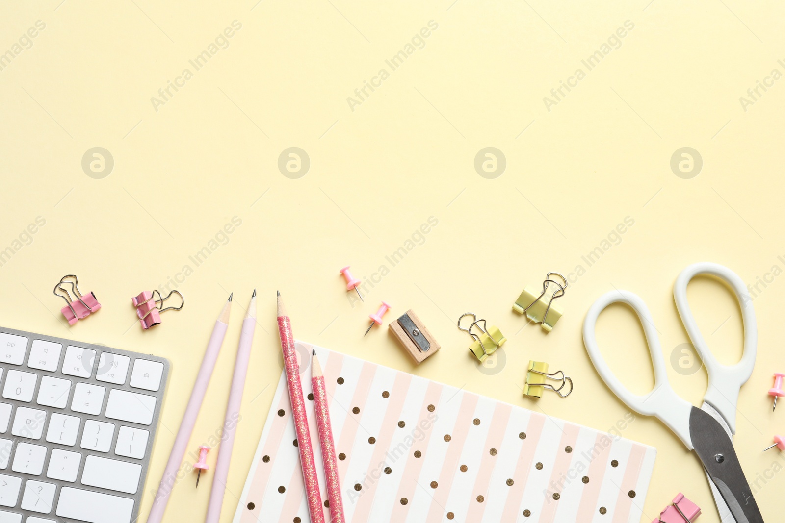 Photo of Flat lay composition with scissors and office supplies on color background. Space for text