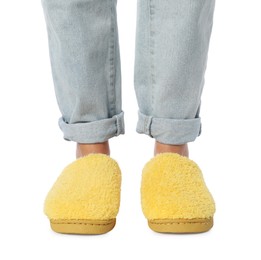 Photo of Woman in yellow soft slippers on white background, closeup