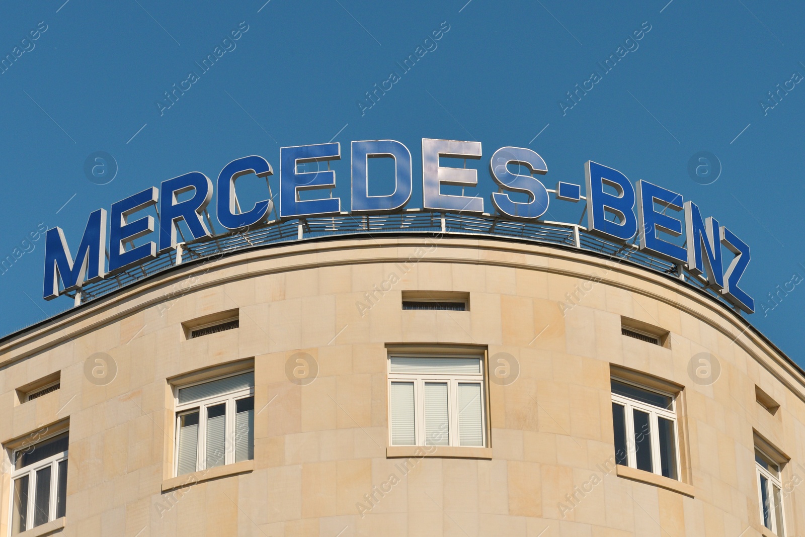 Photo of Poland, Warsaw - June 05, 2022: Building with sign Mercedes Benz on roof outdoors