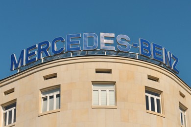 Photo of Poland, Warsaw - June 05, 2022: Building with sign Mercedes Benz on roof outdoors