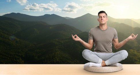 Image of Man practicing yoga on wooden surface against beautiful mountain landscape, space for text. Banner design