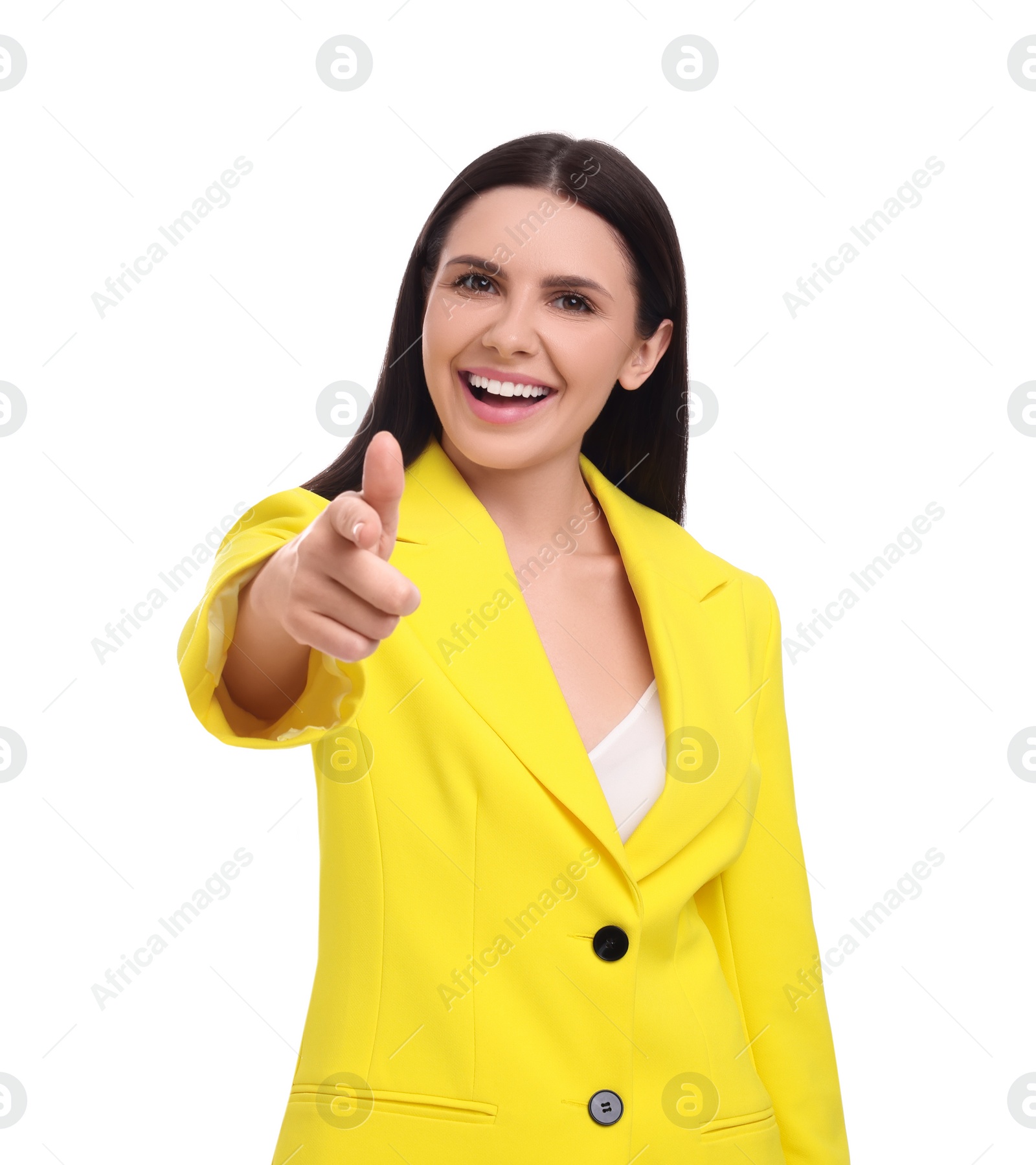 Photo of Beautiful happy businesswoman in yellow suit pointing at something on white background