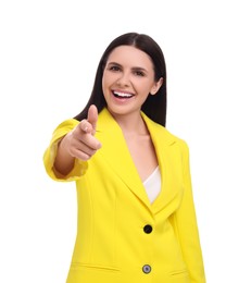 Photo of Beautiful happy businesswoman in yellow suit pointing at something on white background