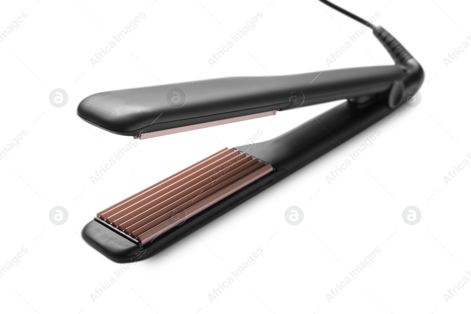 Photo of Modern corrugated hair iron isolated on white