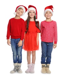 Cute little children in Santa hats on white background. Christmas celebration