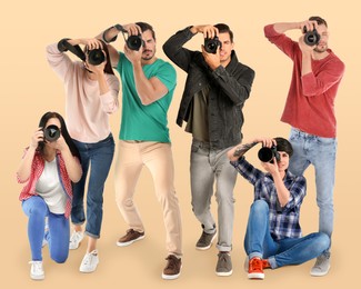 Image of Group of professional photographers with cameras on beige background