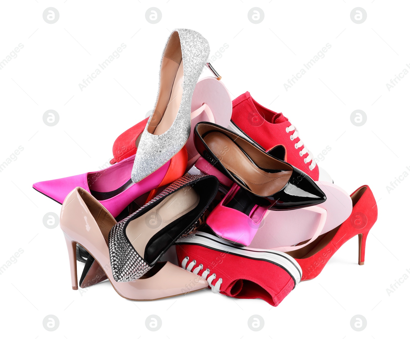 Photo of Pile of different female shoes isolated on white