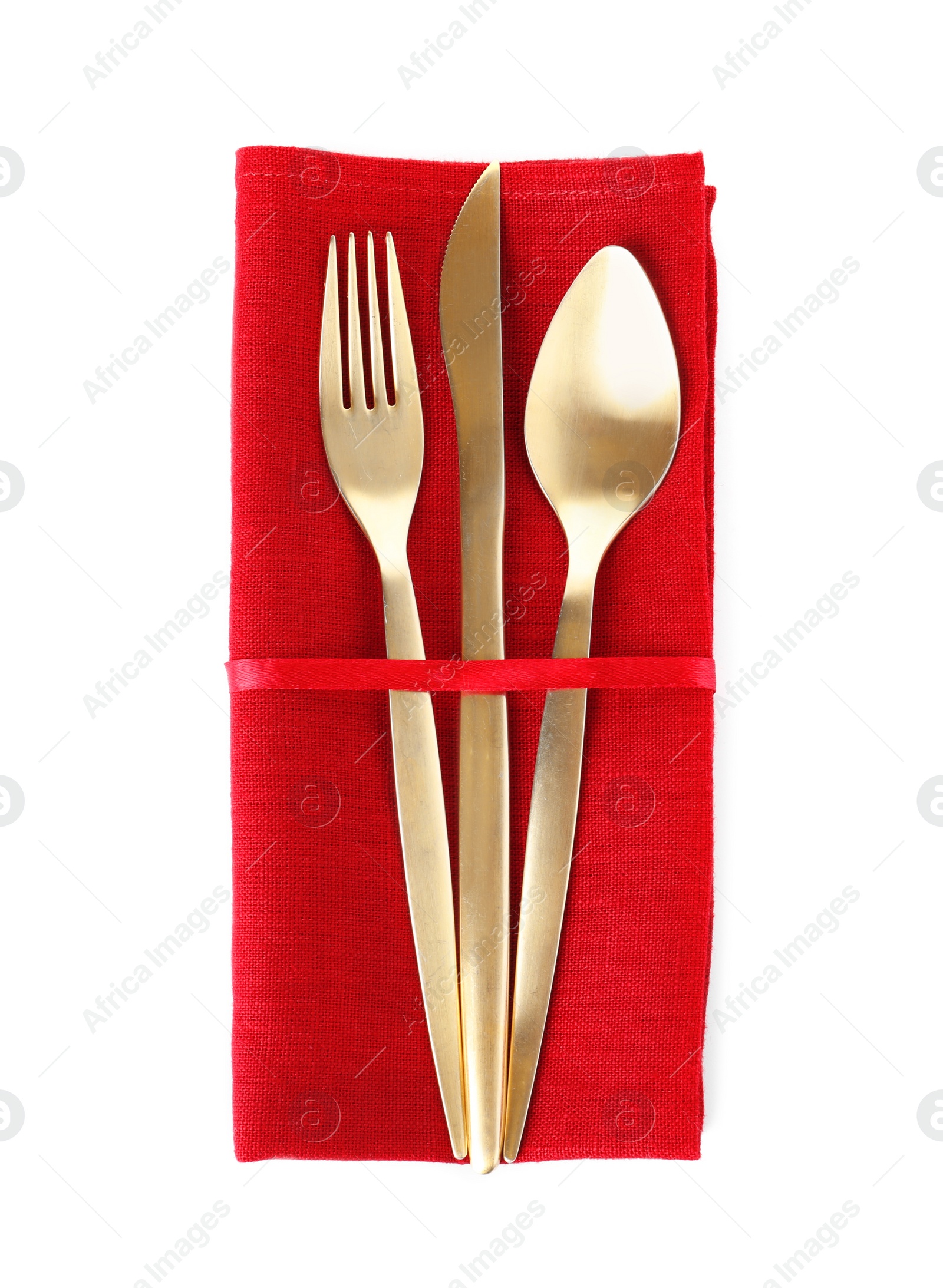 Photo of Napkin with golden cutlery on white background, top view