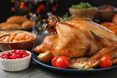 Photo of Traditional festive dinner with delicious roasted turkey served on table