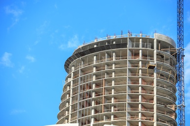 Photo of Unfinished building against blue sky, space for text. Construction safety rules