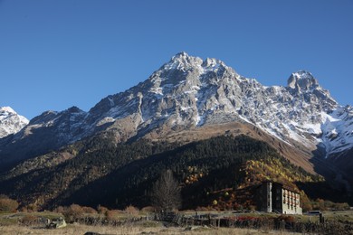 Picturesque view of beautiful high mountain under blue sky on sunny day