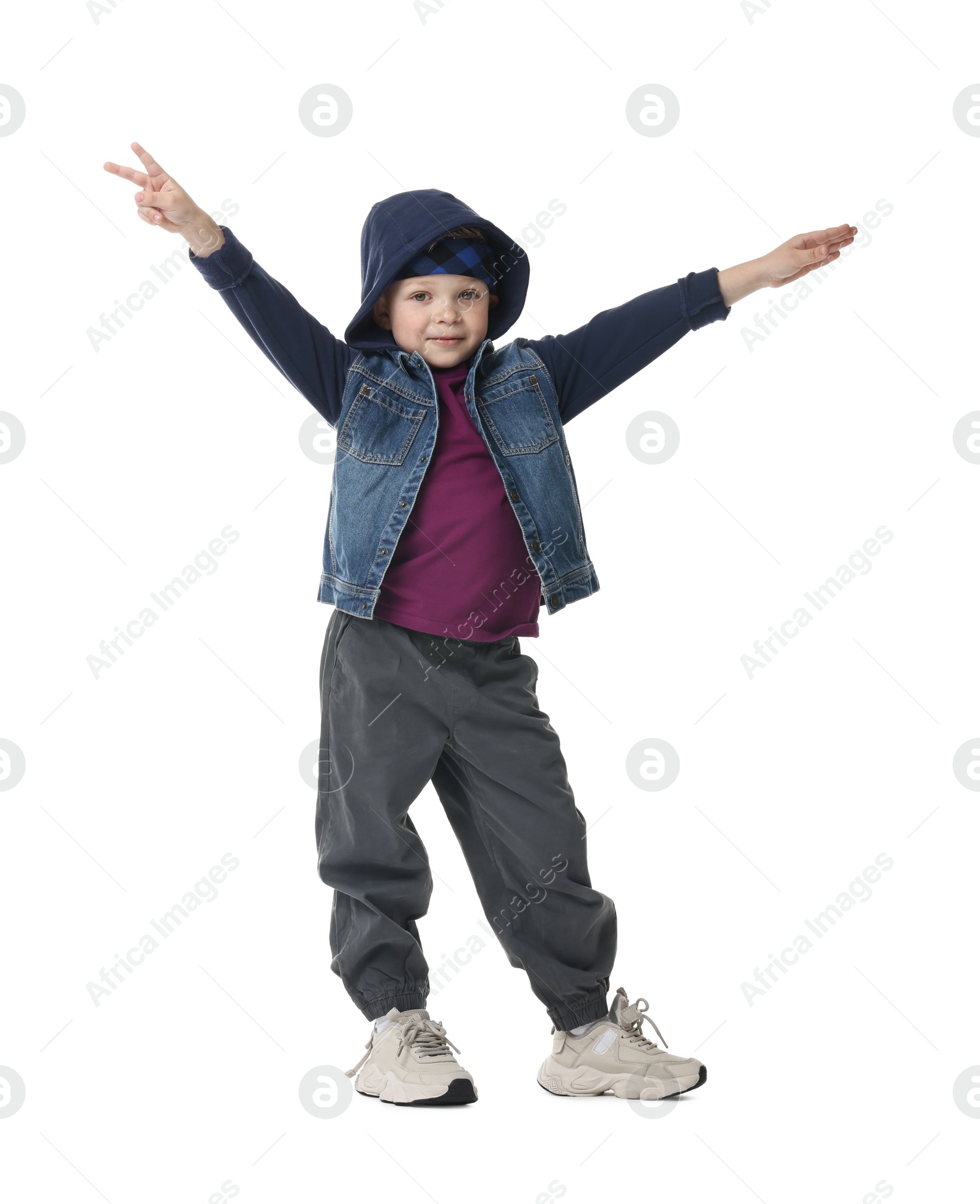 Photo of Happy little boy dancing on white background