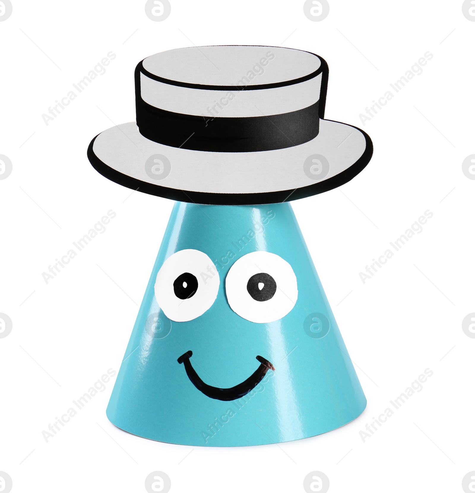 Photo of Bright party hat with funny face isolated on white. Handmade decoration