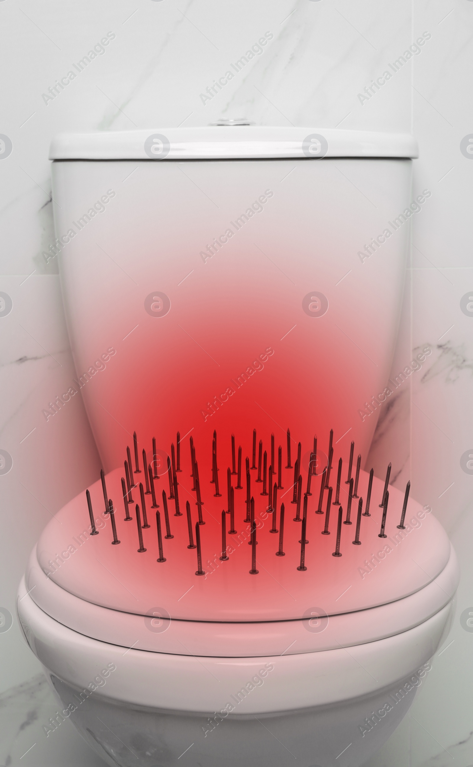 Image of Hemorrhoid concept. Toilet bowl with nails near marble wall