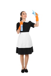 Photo of Young chambermaid with rag and detergent on white background