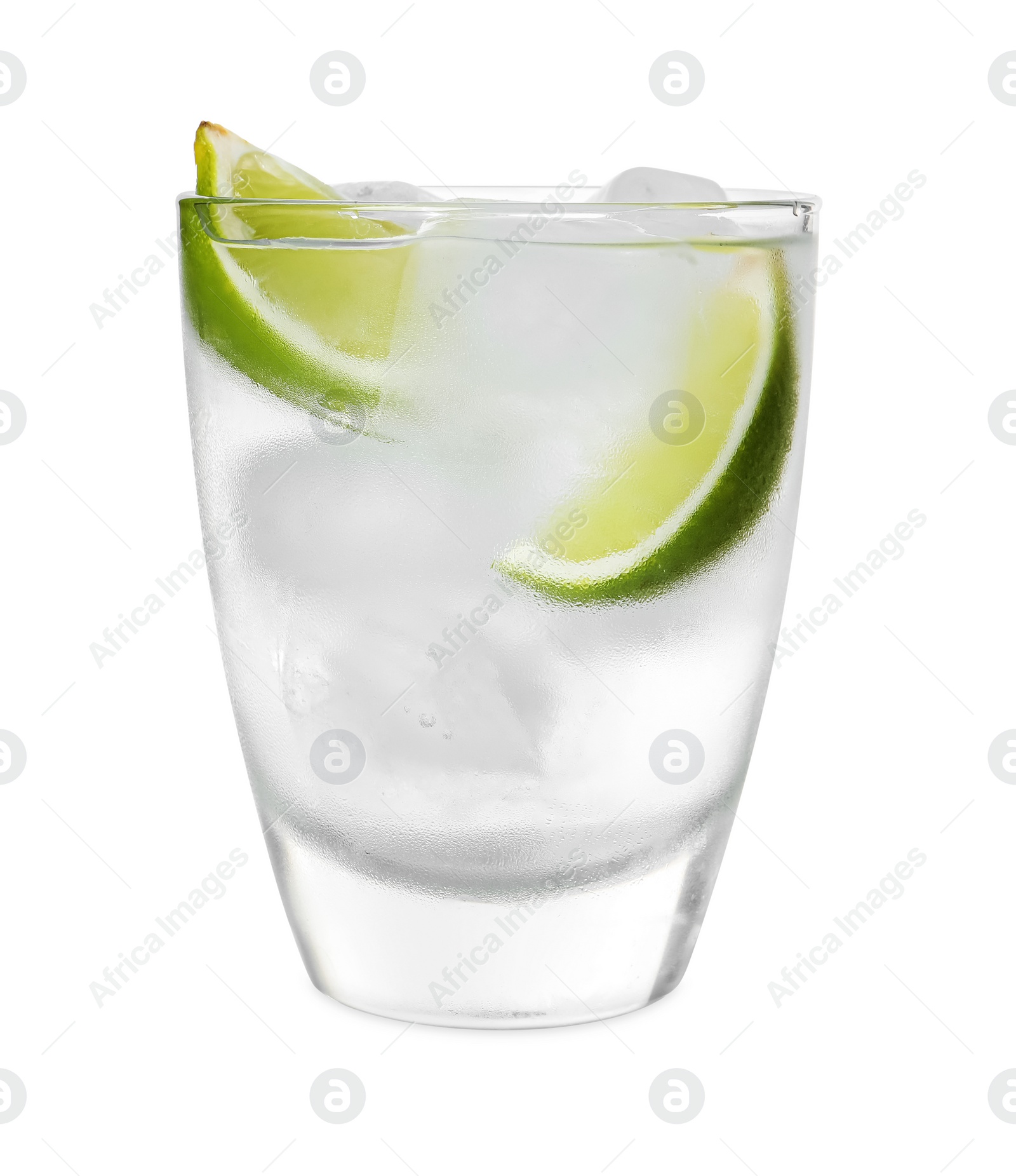 Photo of Glass of vodka with ice and lime isolated on white