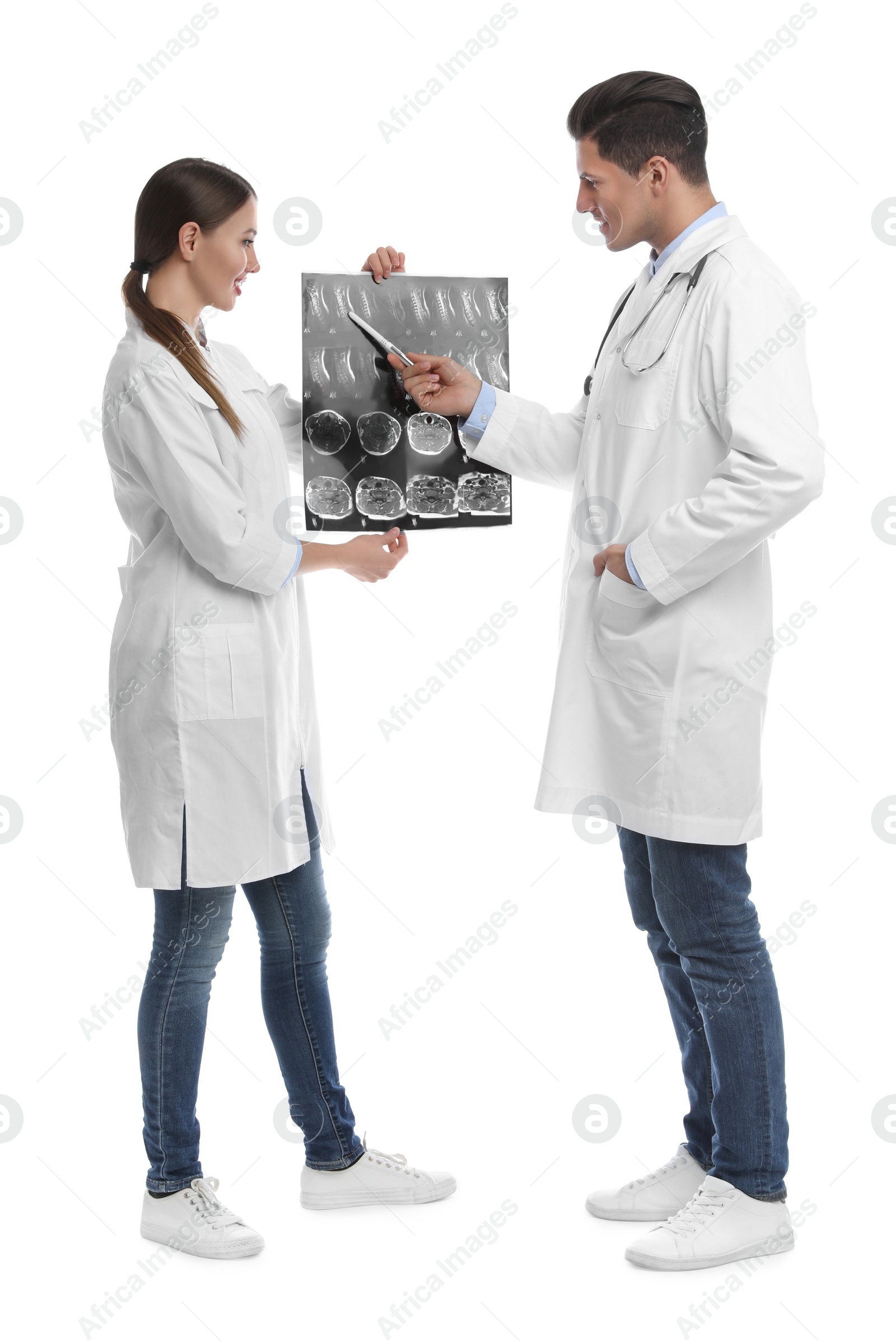 Photo of Orthopedists working with X-ray picture on white background