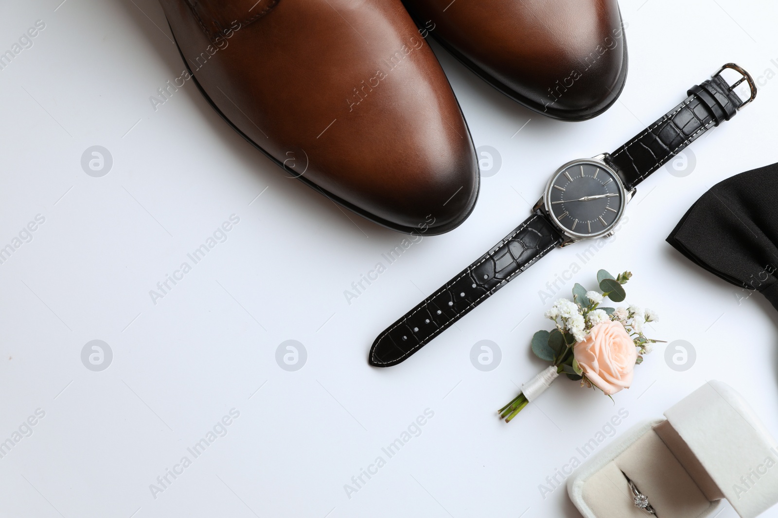 Photo of Composition with wedding shoes for groom on white background, top view
