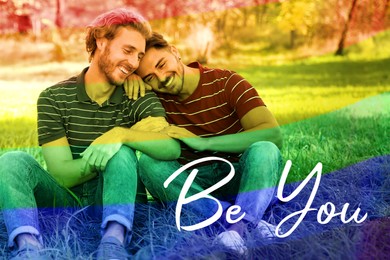 Image of Be You, coming out. Happy gay couple outdoors, toned in rainbow colors