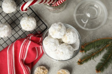 Flat lay composition with Christmas snowball cookies on grey table