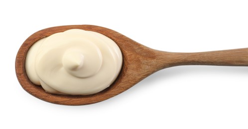 Photo of Natural yogurt in wooden spoon isolated on white, top view