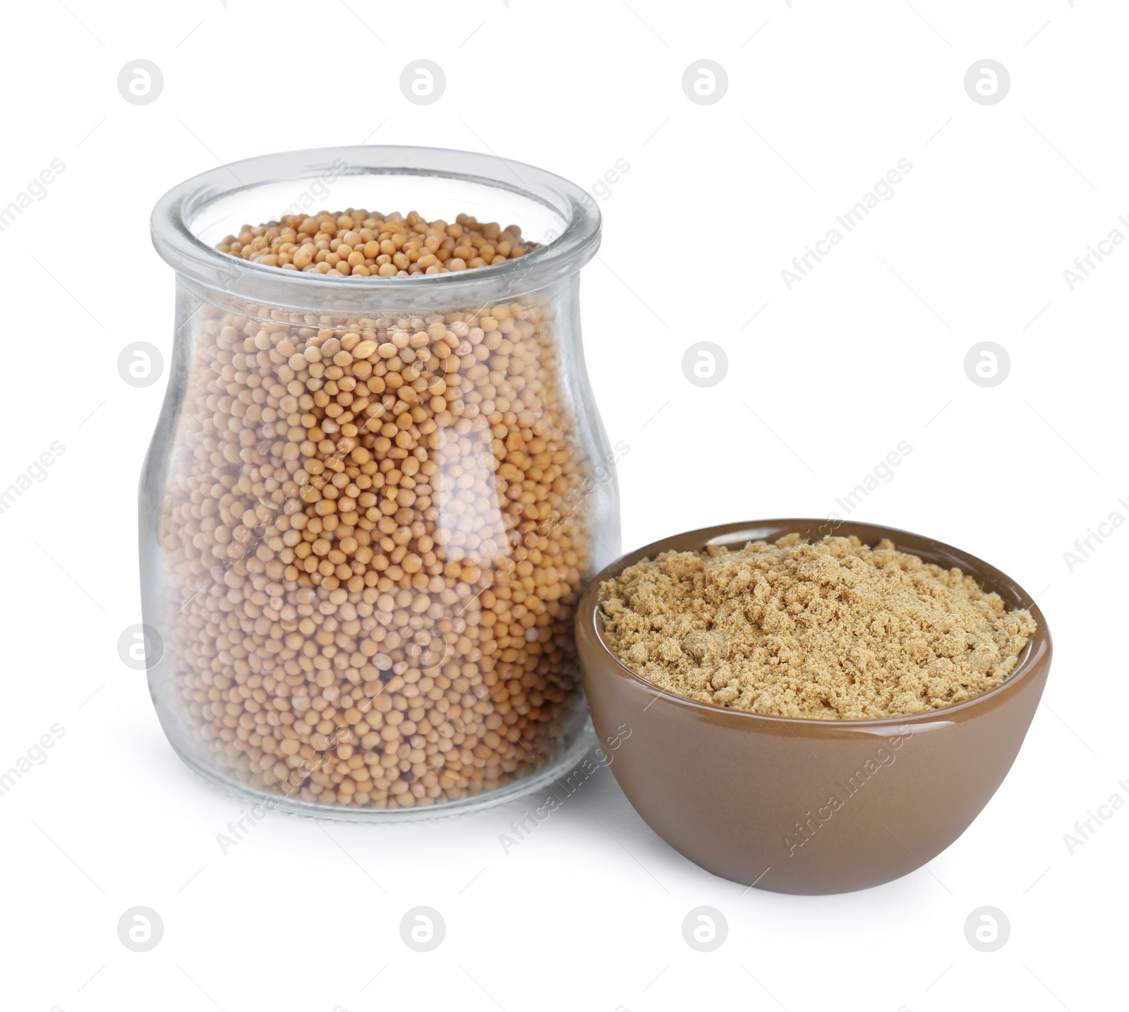 Photo of Aromatic mustard powder in bowl and glass jar with seeds on white background