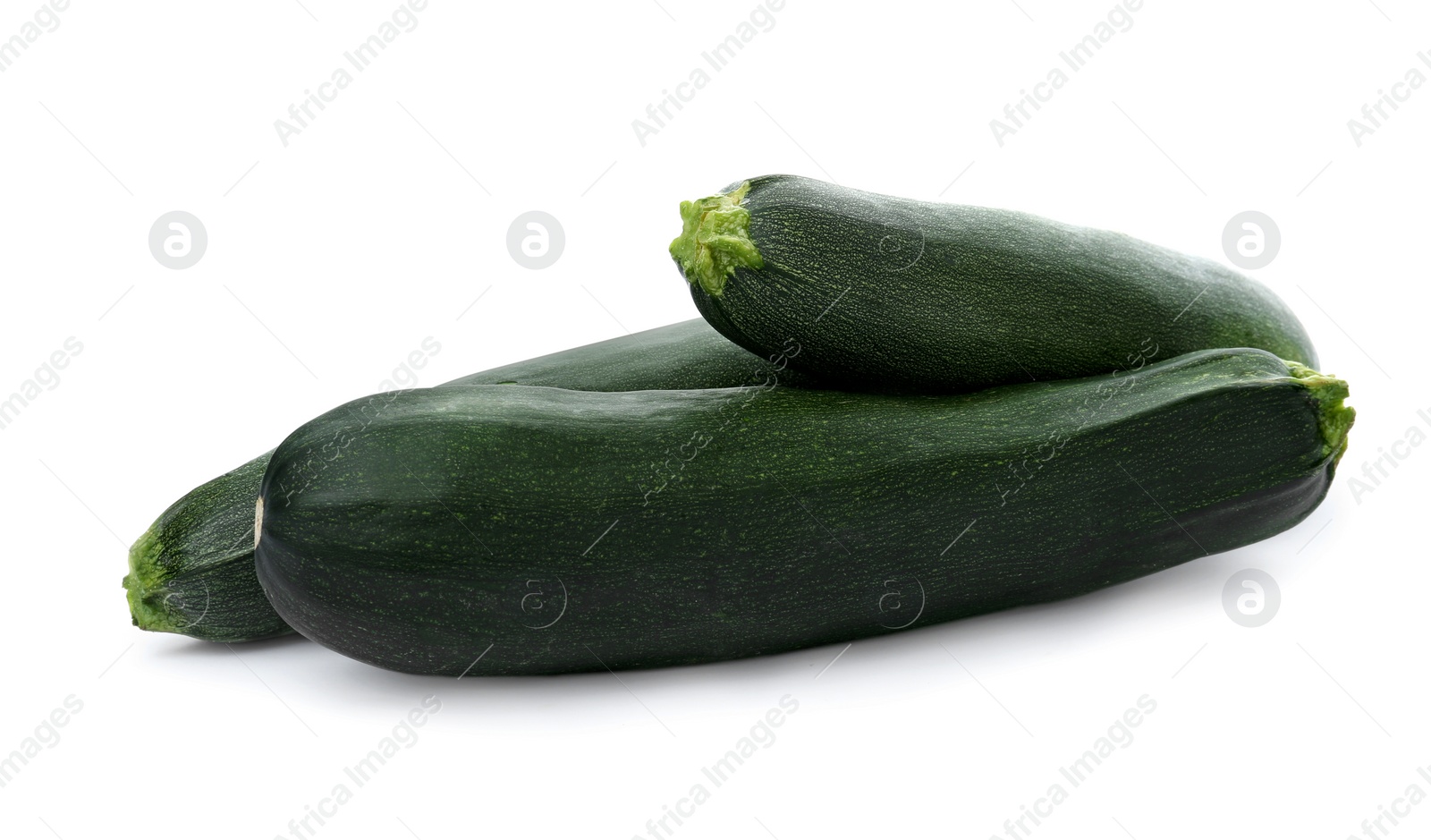 Photo of Fresh ripe green zucchinis on white background