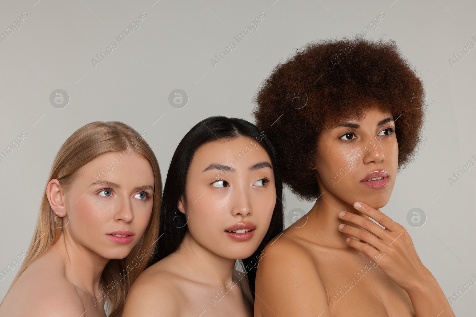 Photo of Portrait of beautiful young women on light grey background