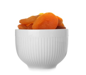 Photo of Bowl with apricots on white background. Dried fruit as healthy food