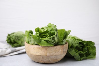 Photo of Fresh green romaine lettuces on grey table