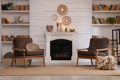 Photo of Cozy living room interior with comfortable armchairs near fireplace