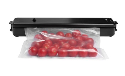 Photo of Sealer for vacuum packing with plastic bagcherry tomatoes on white background