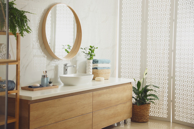 Stylish bathroom interior with mirror and countertop. Design idea