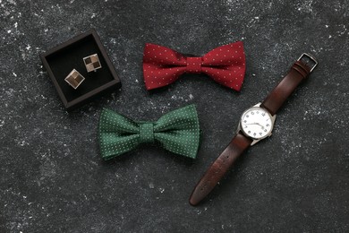 Flat lay composition with stylish color bow ties on grey background