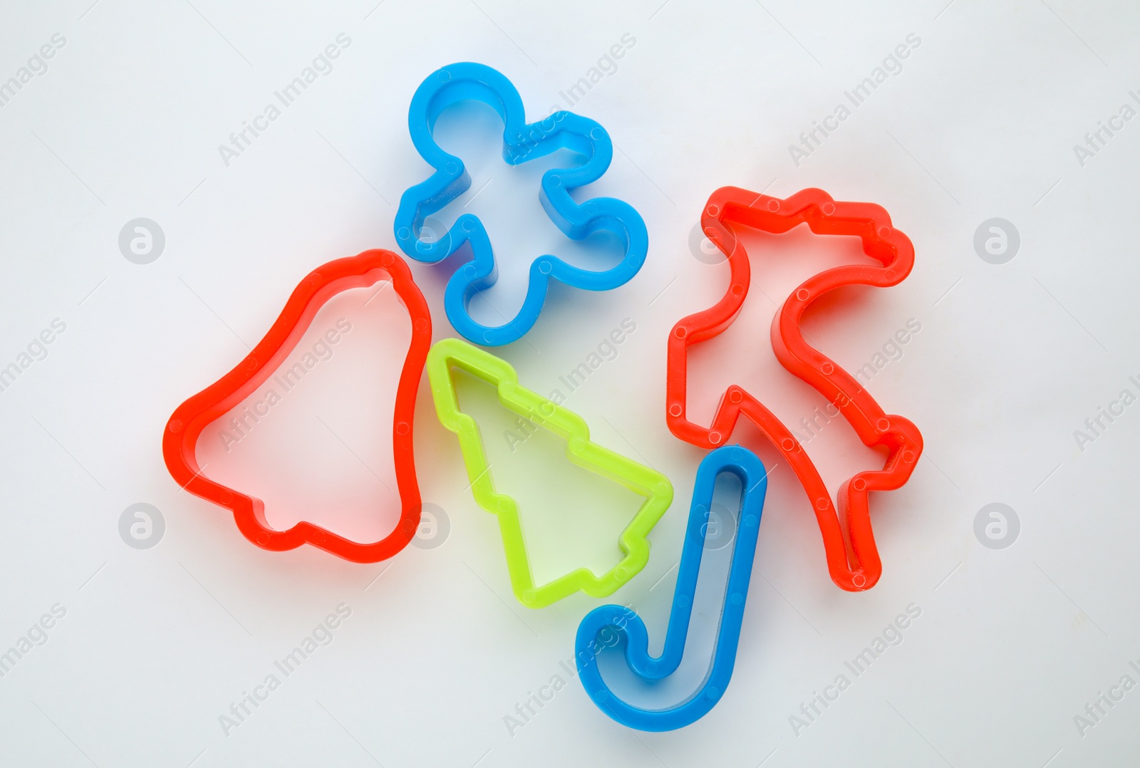 Photo of Cutters for Christmas cookies on white background