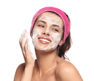 Beautiful woman applying facial cleansing foam on white background