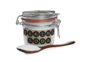 Photo of Spoon and jar with baking soda on white background