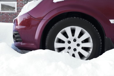 Modern car with reliable tire on snow outdoors